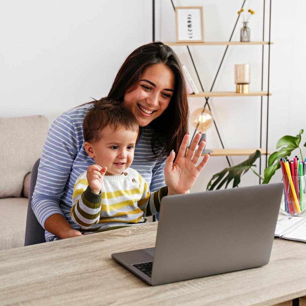 Mother and child using a laptop together at home